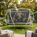child-bouncing-on-white-frame-garden-trampoline-while-sibling-watches