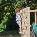 child-climbing-wooden-climbing-wall-on-wooden-climbing-cube