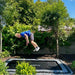 child-jumping-high-on-north-rectangular-inground-trampoline