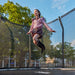 child-jumping-inside-salta-premium-black-edition-trampoline-safety-enclosure