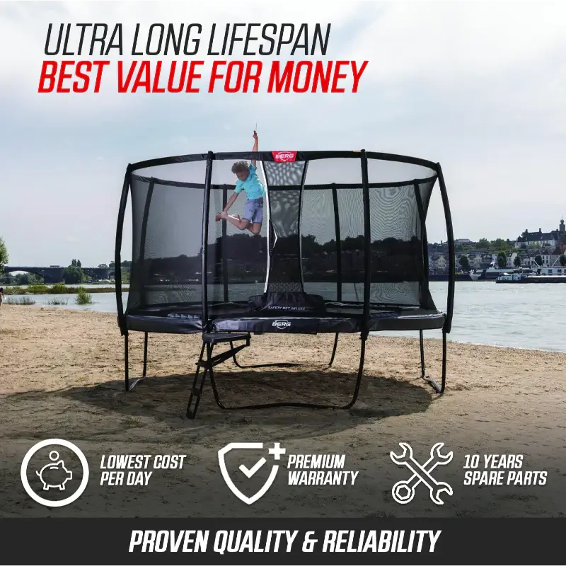 child-jumping-on-berg-trampoline-by-water-with-safety-net-premium-warranty-and-long-lifespan-features