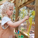 child-painting-yellow-shapes-on-clear-art-panel-of-wooden-playcentre