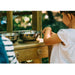 child-playing-at-plum-discovery-mud-pie-kitchen