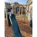 child-sitting-on-wooden-climbing-cube-platform-above-camo-den