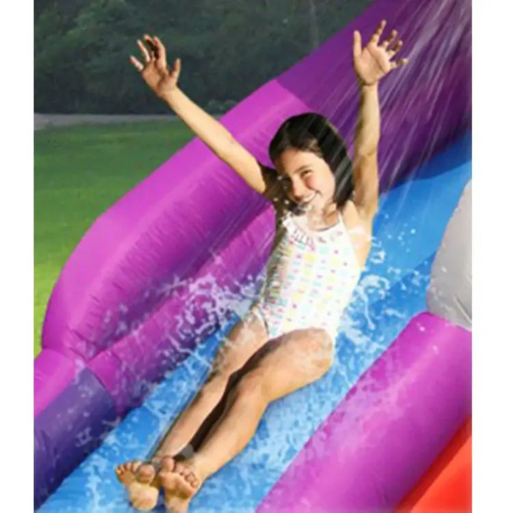 child-sliding-down-wet-inflatable-shark-slide