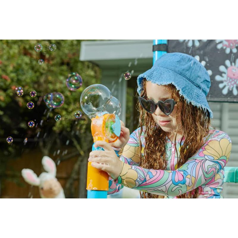 child-using-bubble-blaster-on-plum-play-water-park-shower-tower