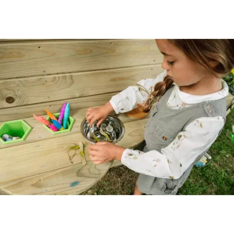 child-using-play-shelf-on-plum-discovery-nature-play-hideaway