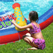 child-using-water-cannon-on-inflatable-shark-splash-slide