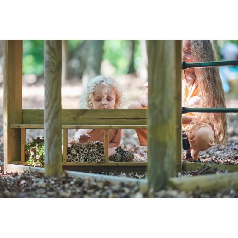 children-looking-at-bug-hotel-under-wooden-playcentre-in-forest-setting