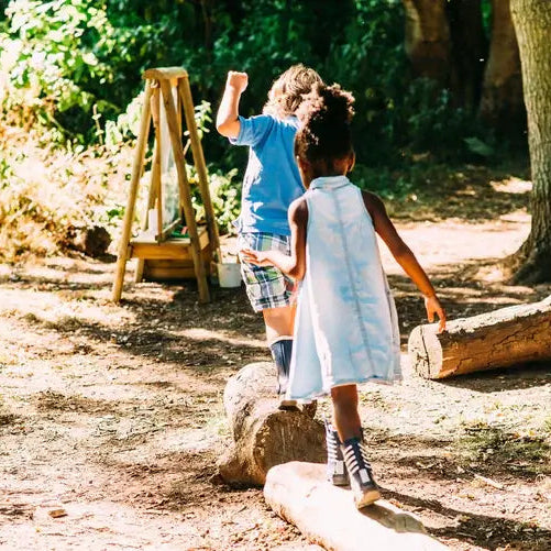 children-playing-near-plum-discovery-create-and-paint-easel