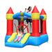 children-playing-on-bouncy-castle-with-slide-and-hoop
