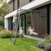 children-playing-on-wall-mounted-climbing-frame-and-swing-in-modern-garden_bcdb6077-1ad4-4525-a34b-f649a955953b