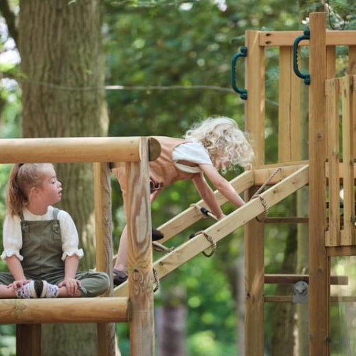 children-playing-on-wooden-adventure-playcentre-with-rope-ramp-and-raised-platform