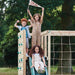 children-playing-on-wooden-climbing-cube-with-slide-and-rope-net