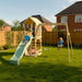 children-playing-on-wooden-lookout-tower-with-slide-swings-and-sand-play-area