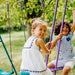 children-smiling-on-plum-jupiter-glider-swing