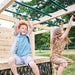children-using-monkey-bars-on-wooden-climbing-cube
