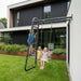 children-using-wall-mounted-swing-and-climbing-frame-outside-contemporary-home_a1d83fe2-f9c1-4b46-9ba7-59198fa43727