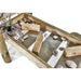 close-up-of-central-water-run-table-with-clear-panels-wooden-diverters-and-stones