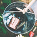 close-up-of-metal-play-bucket-filled-with-water-and-copper-cup