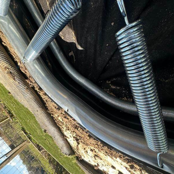 close-up-of-north-rectangular-inground-trampoline-springs-and-frame