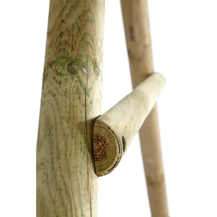 close-up-of-pressure-treated-round-pole-pine-wood-showing-natural-cracks-and-grain-on-bush-baby-swing-set