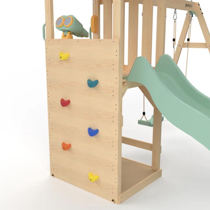 close-up-of-wooden-lookout-tower-climbing-wall-with-colourful-rock-holds-binoculars-and-slide
