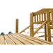 close-up-of-wooden-platform-deck-and-rope-bridge-leading-to-raised-tower