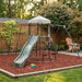 compact-garden-activity-frame-with-canopy-top-slide-and-swing-over-bark-surface