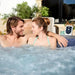 couple-enjoying-lay-z-spa-carrara-airjet-massage