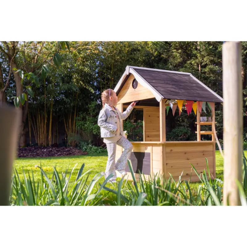 lifestyle-shot-of-exit-hika-outdoor-playhouse-placed-on-grass