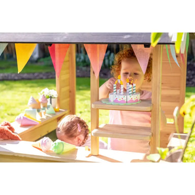 exit-hika-wooden-outdoor-playhouse-cake-on-shelves