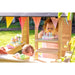 exit-hika-wooden-outdoor-playhouse-cake-on-shelves