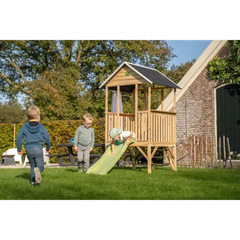 exit-panorama-elevated-playhouse-with-slide-outdoor-setup