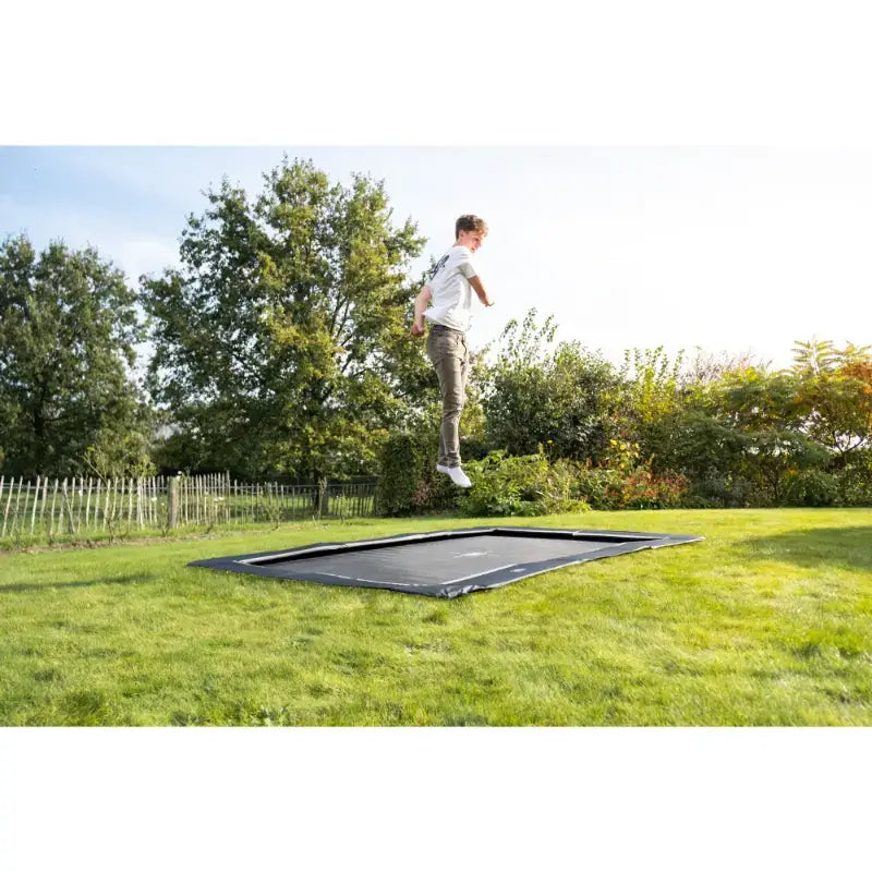 exit-rectangle-in-ground-trampoline-with-adult-jumping