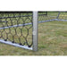 Lifestyle shot of EXIT Scala ground anchors securing the football goal on grass