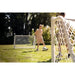 Lifestyle shot of EXIT Scala white football goal with kids playing football.
