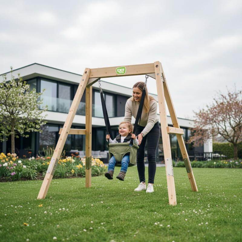 exit-toys-silvi-wooden-swing-frame-with-baby-seat-and-parent-pushing-child-in-garden