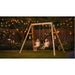 exit-toys-silvi-wooden-swing-set-with-two-children-and-garden-lights-at-night