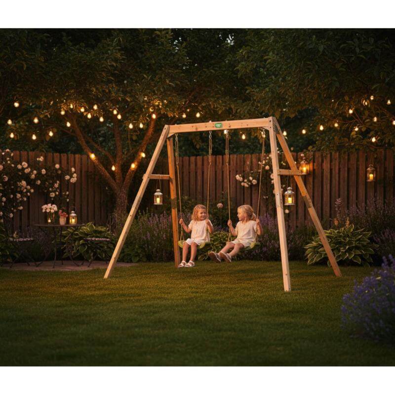 exit-toys-silvi-wooden-swing-set-with-two-children-and-garden-lights-at-night_f83e1ac4-7d03-4439-87f4-32b470f61683