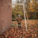 exit-toys-silvi-wooden-wall-mounted-swing-with-child-in-autumn-garden