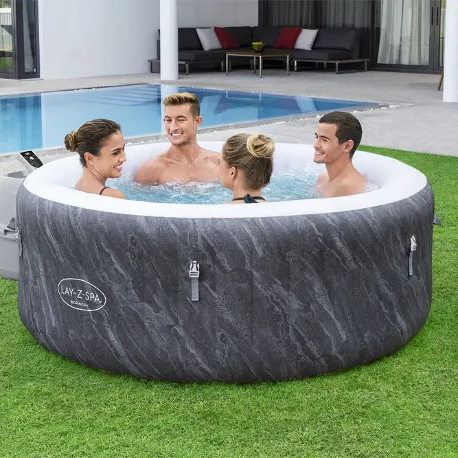 four-adults-enjoying-lay-z-spa-boracay-airjet-hot-tub