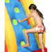girl-climbing-inflatable-wall-on-shark-themed-water-slide