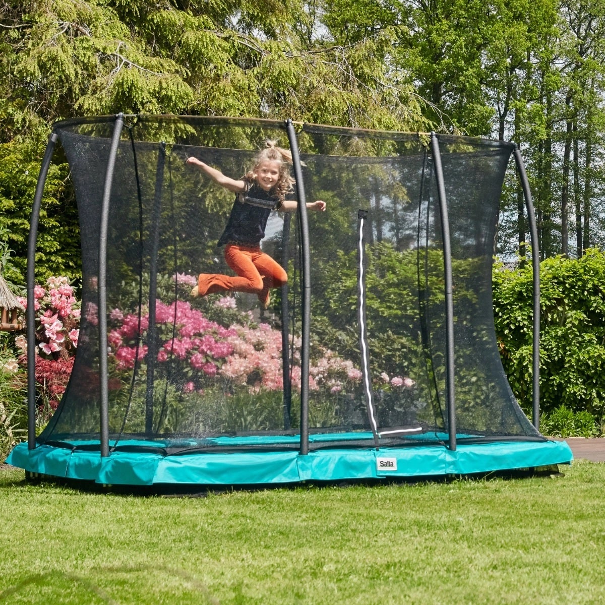 girl-enjoying-salta-rectangular-trampoline-in-a-family-garden