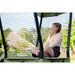 girl-leaning-on-net-wall-on-exit-ivy-outdoor-playset