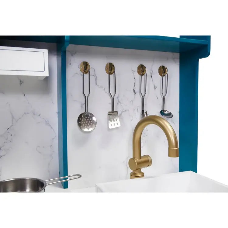 gold-faucet-and-hanging-utensils-on-marble-style-backsplash