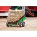 green-farm-trailer-loaded-with-hay-bales-in-a-farmyard