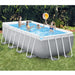 family playing in intex-rectangular-prism-pool-set-4-88m-x-2-44m-x-1-07m