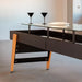 detailed-view-of-iroko-wood-legs-and-steel-frame-and-glass-dining-top-of-rs-barcelona-shuffleboard