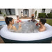 jacuzzi-lay-z-spa-ibiza-white-interior-wall-and-rim-detail-with-four-people-enjoying-a-drink